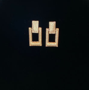 Gold rectangle statement earring.