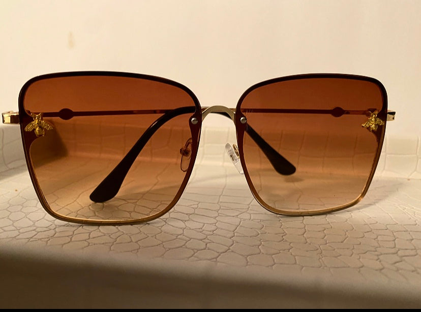 Gold gradient tea, oversize square sunglasses superstar luxury brand designer.